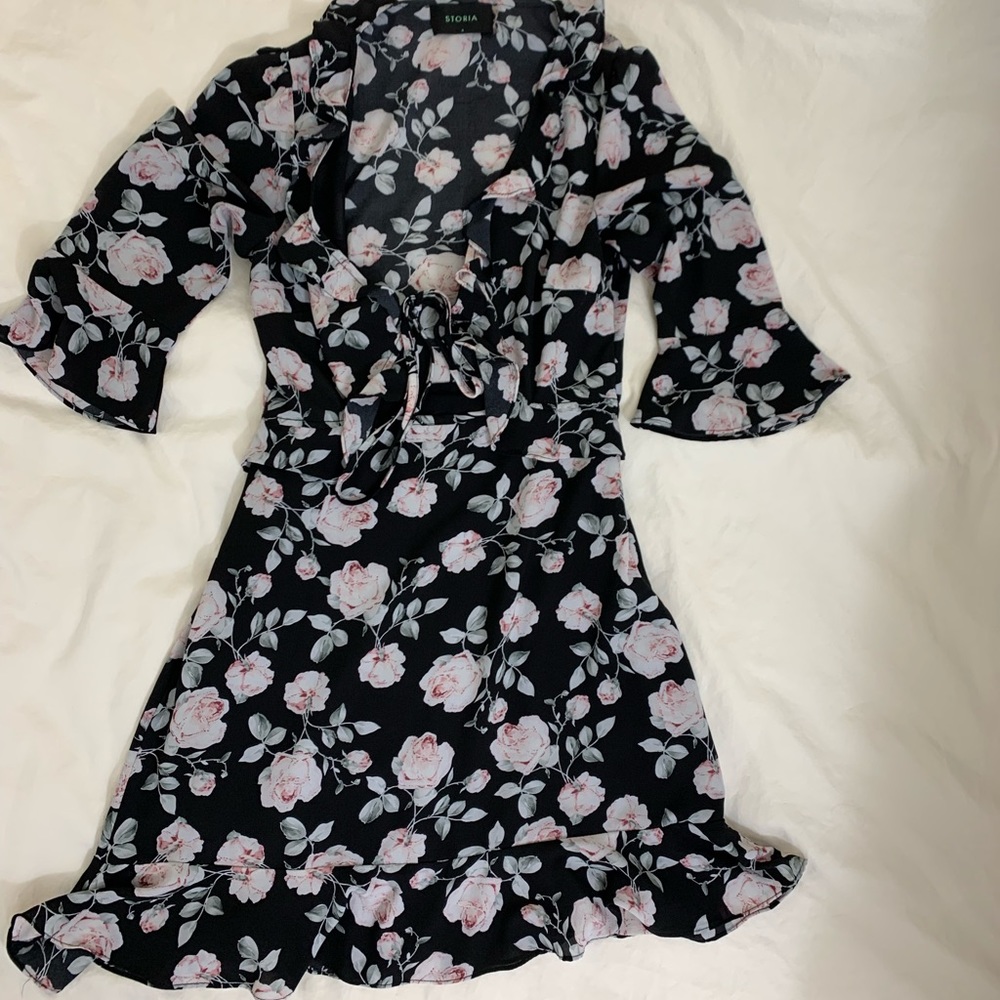 Boutique black floral ruffle dress with cut out in the front size small